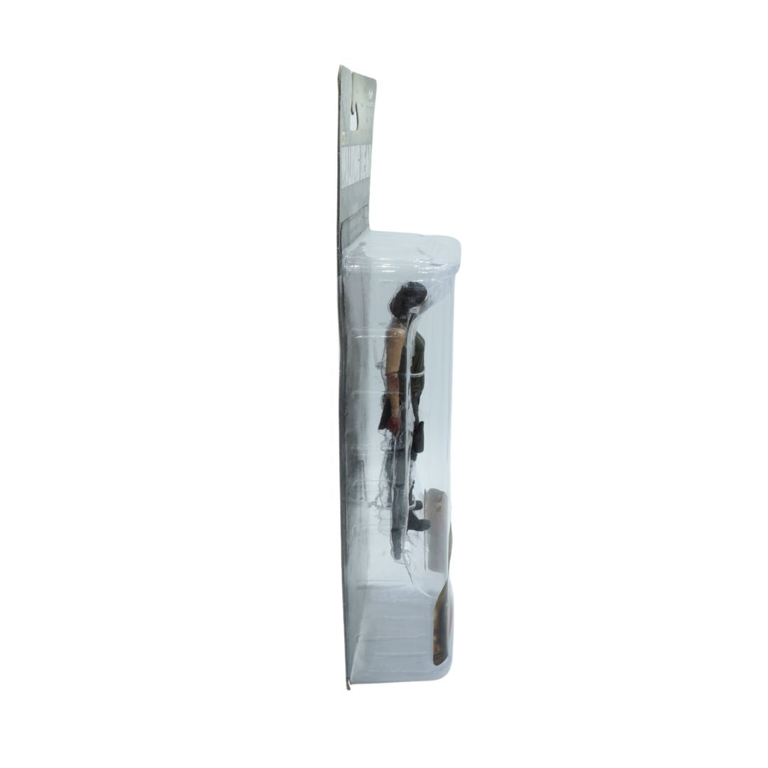Clear plastic packaging with a figurine inside on a white background