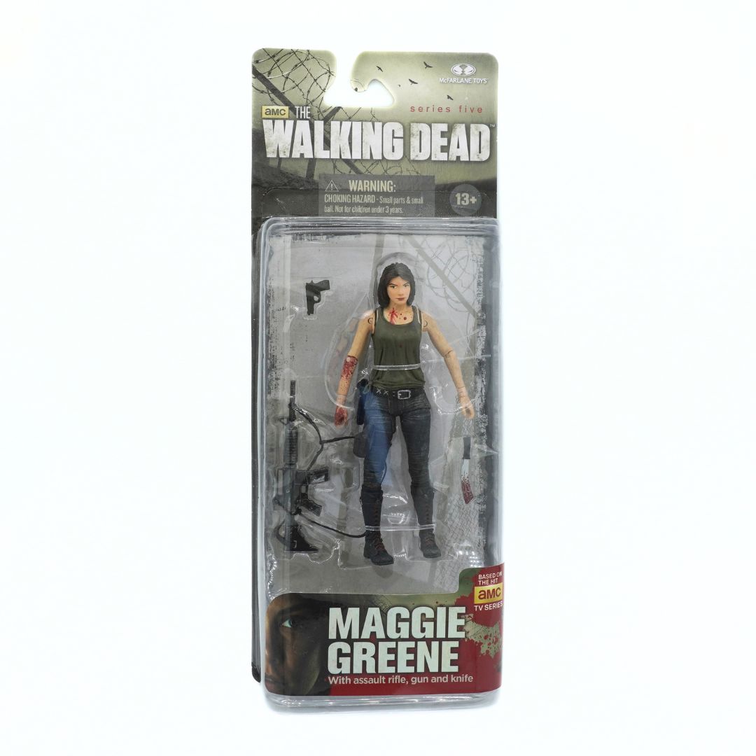Action figure of Maggie Greene from 'The Walking Dead' in packaging on a white background