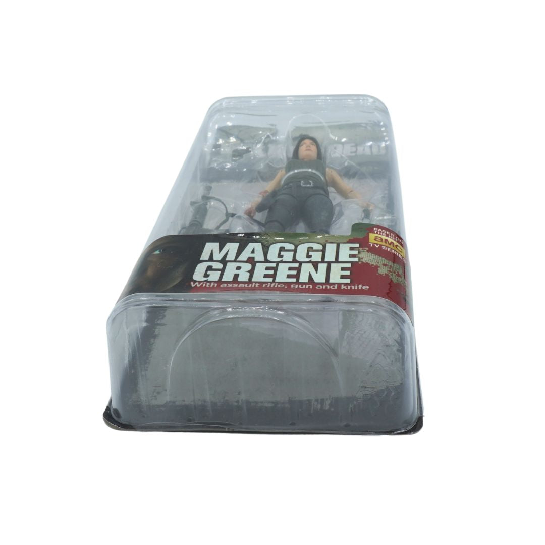 Action figure in packaging with 'Maggie Greene' label on a white background