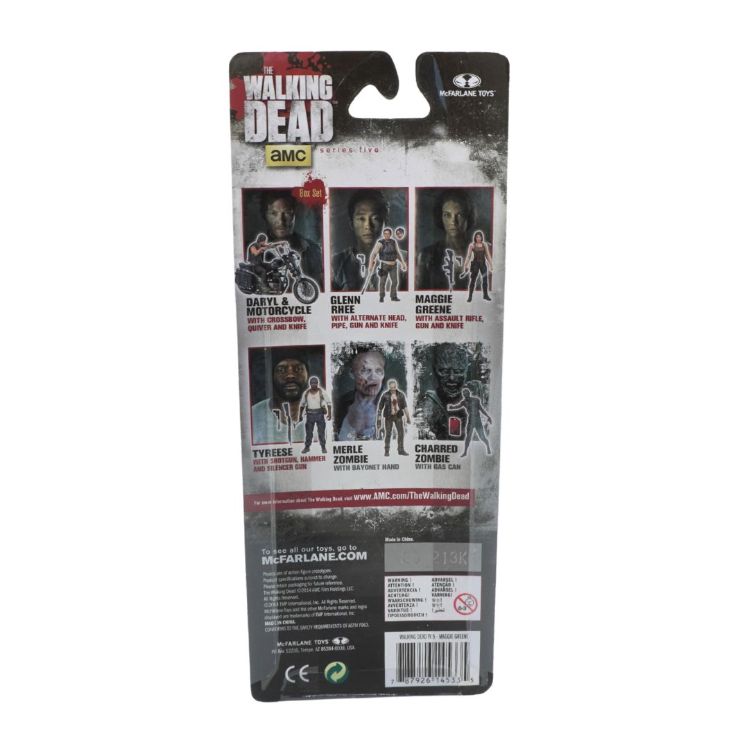 Package of 'The Walking Dead' action figure with character images and branding.
