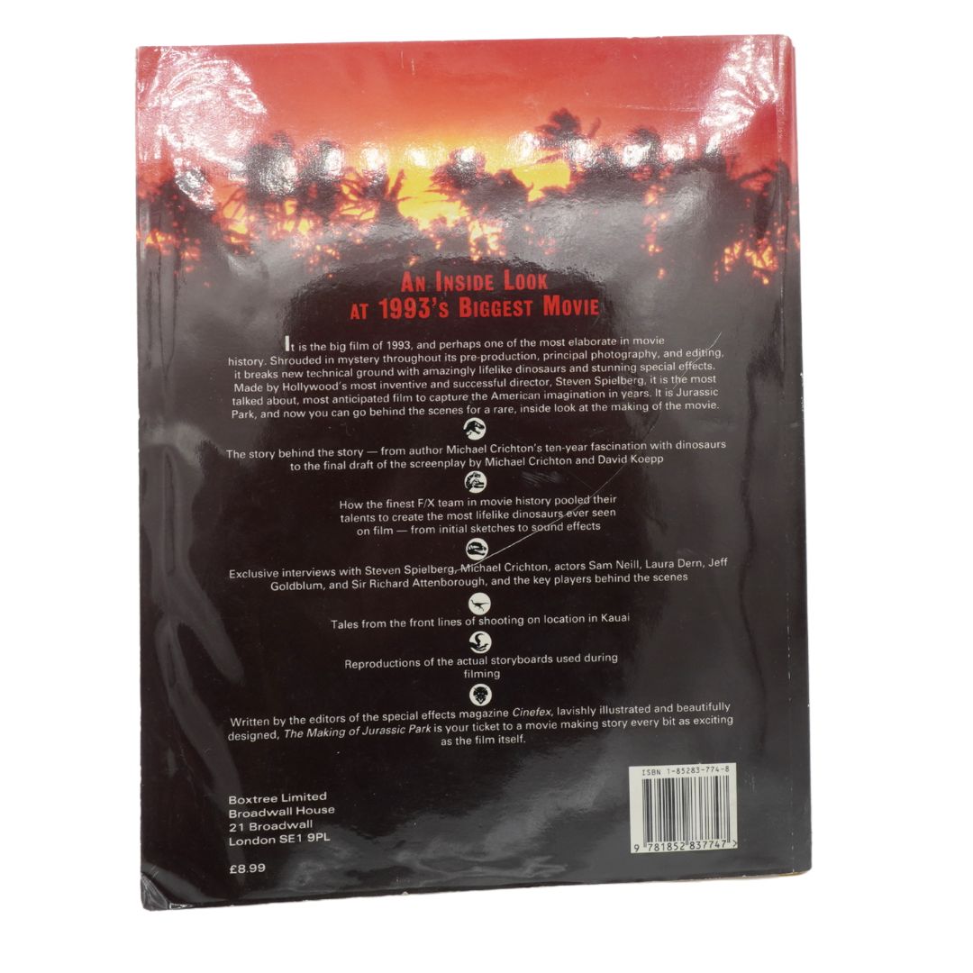 Back cover of a vintage 1993 Jurassic Park book with a black and red cover on a white background