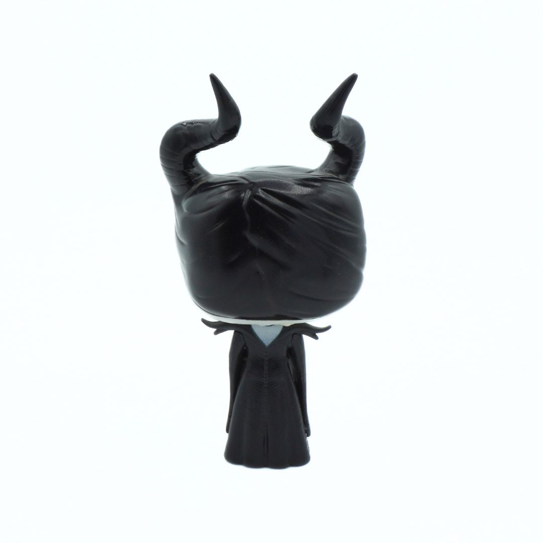 A black vinyl figure of Maleficent from Sleeping Beauty, shown from the back against a plain white background.
