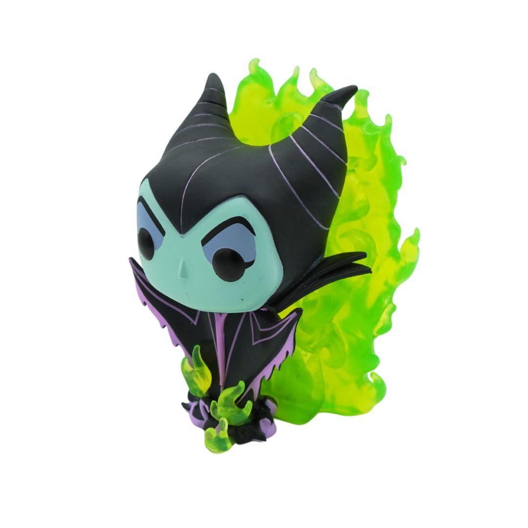 A chibi-style collectible figure of Maleficent from Disney's Sleeping beauty with a green face, and a bright neon green translucent flame-shaped accessory behind her, shown on a plain white background.