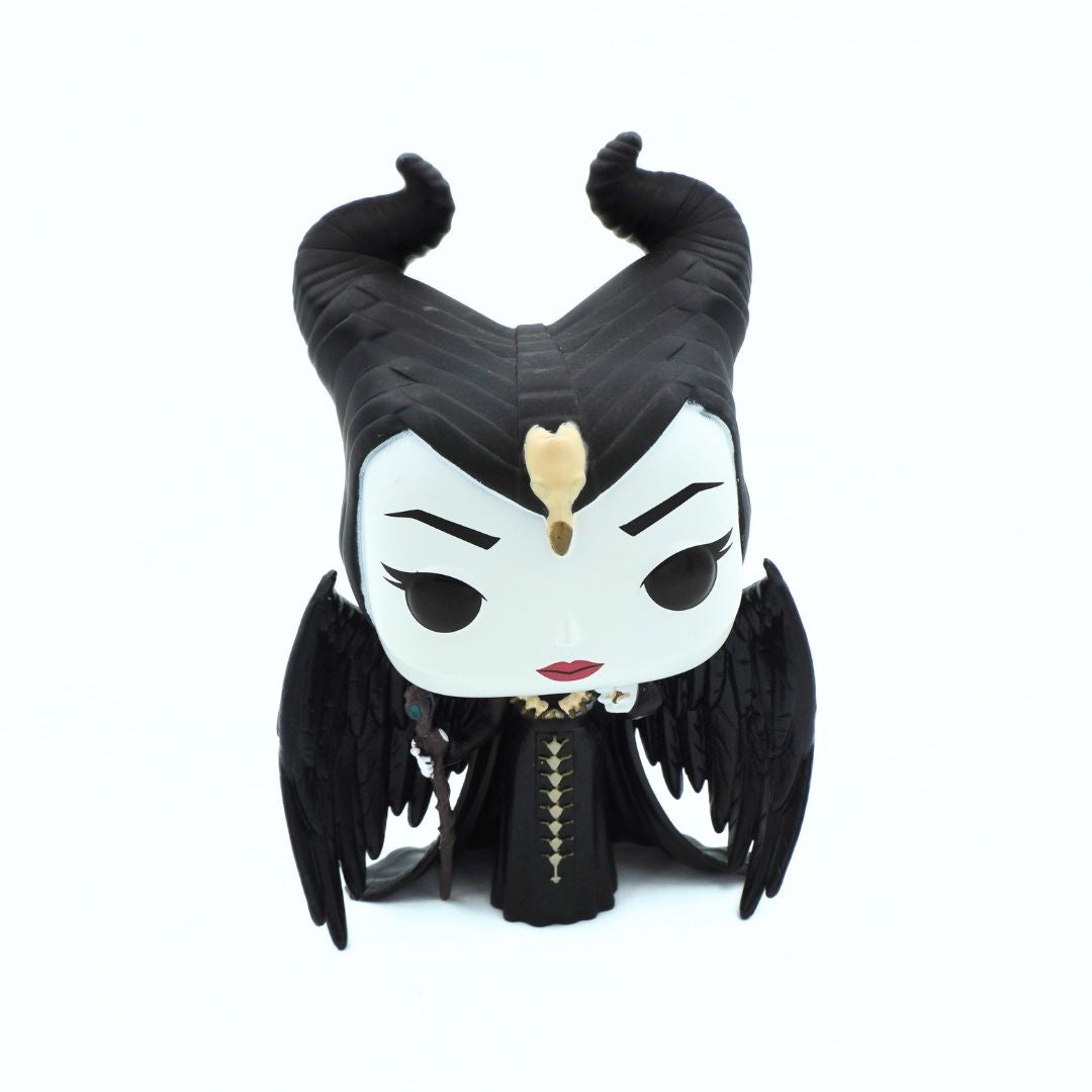 A Funko Pop! vinyl figure of Maleficent from Sleeping Beauty, featuring her signature black horns, black dress, and gold tiara, set against a plain white background.