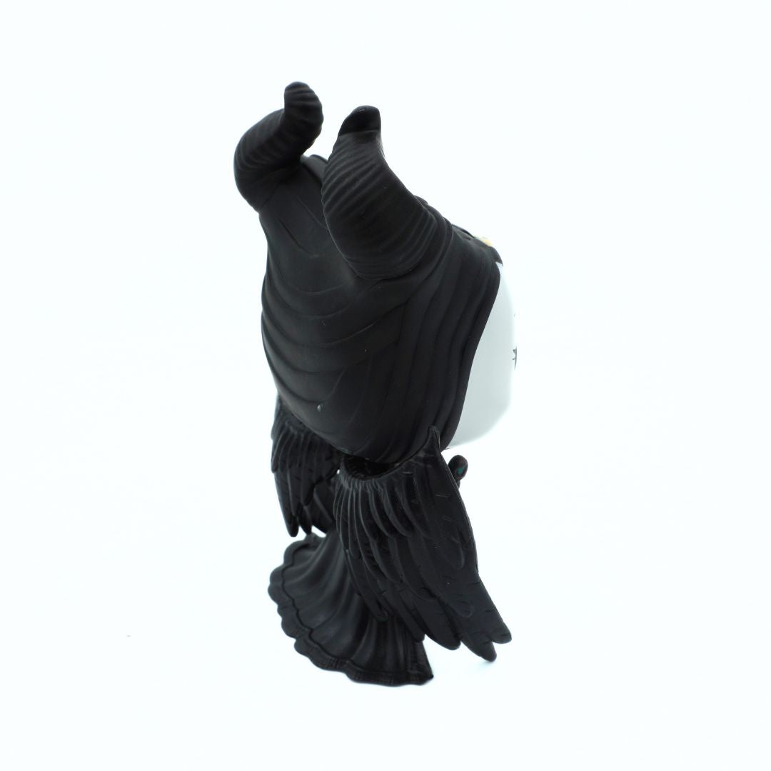 A black sculpted figurine or decorative object with a glossy finish, photographed against a plain white background.