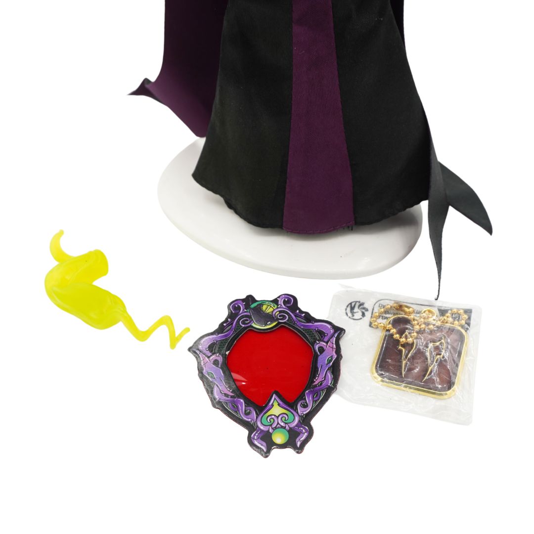 Accessories at the base of a Maleficent figurine wearing a black and purple dress