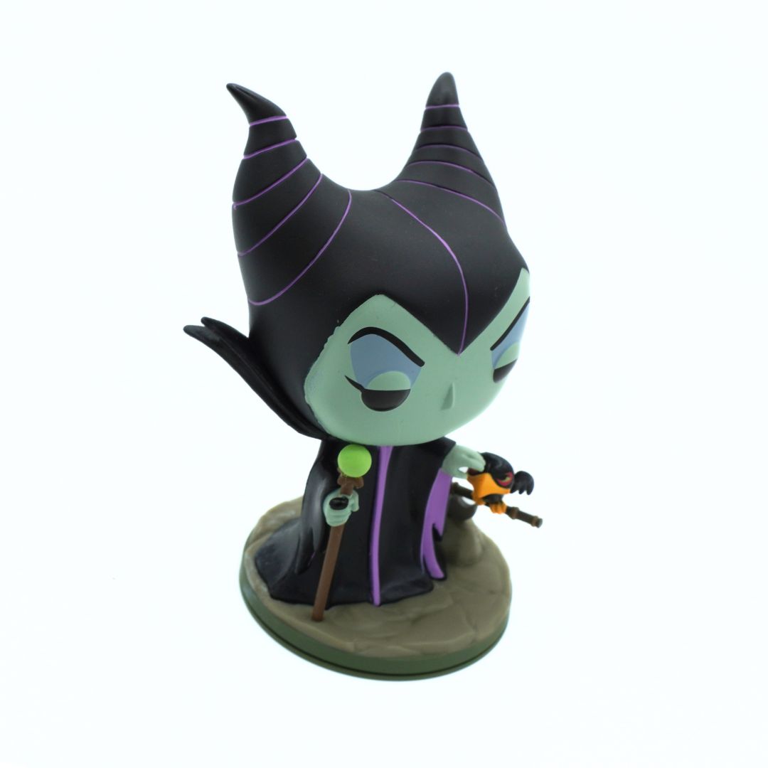 A stylized Funko figurine of Maleficent from Disney's Sleeping Beauty, standing on a round base against a plain white background.
