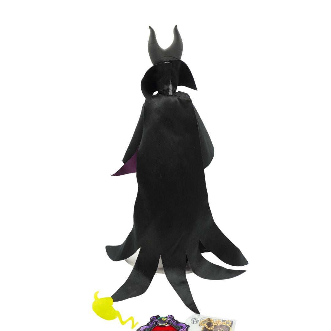 A Maleficent from Sleeping Beauty figurine with a black and purple dress, black hat and green face.