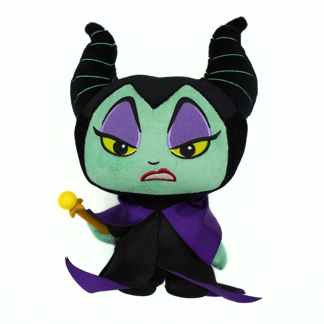 A plush toy of the Disney Princess character Maleficent, featuring her signature green skin, black horns, purple cape, and a small gold staff, set against a plain white background.