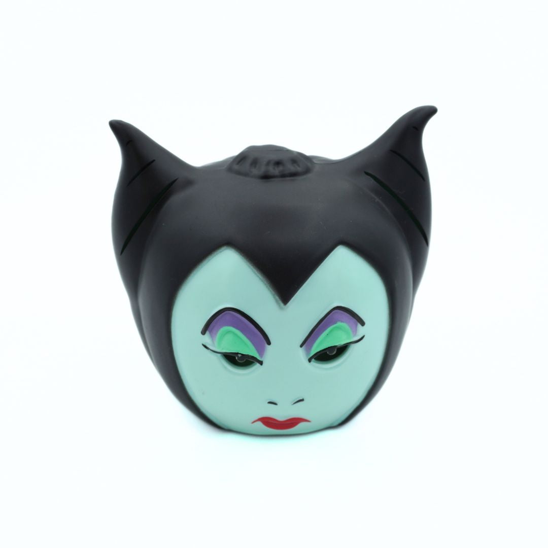 A Maleficent character head sculptural decor piece featuring her signature black hair, pale green skin, and purple and green eye makeup, set against a plain white background.