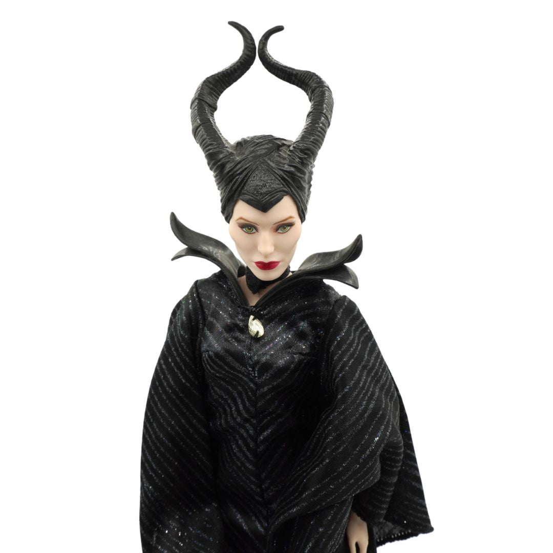 Close up image of Maleficent wearing a black dress and with a hat with horns