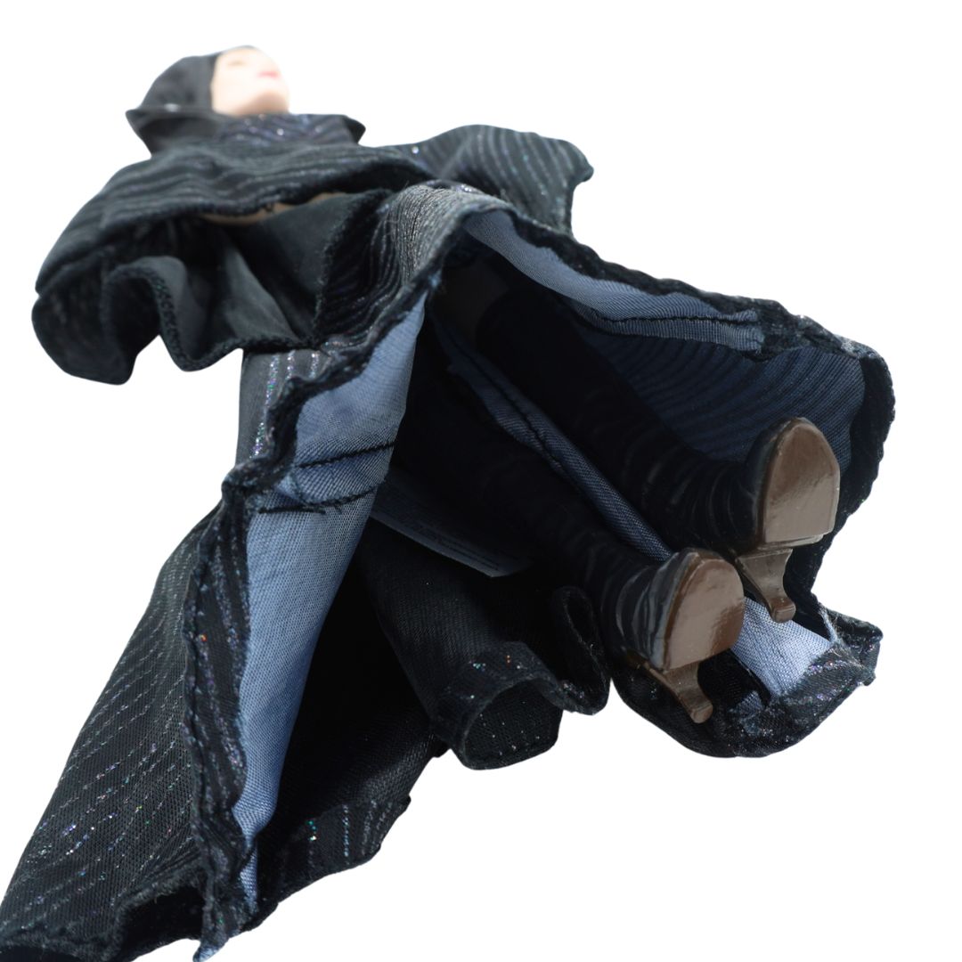 Underside image of Maleficent wearing a black dress and with a hat with horns