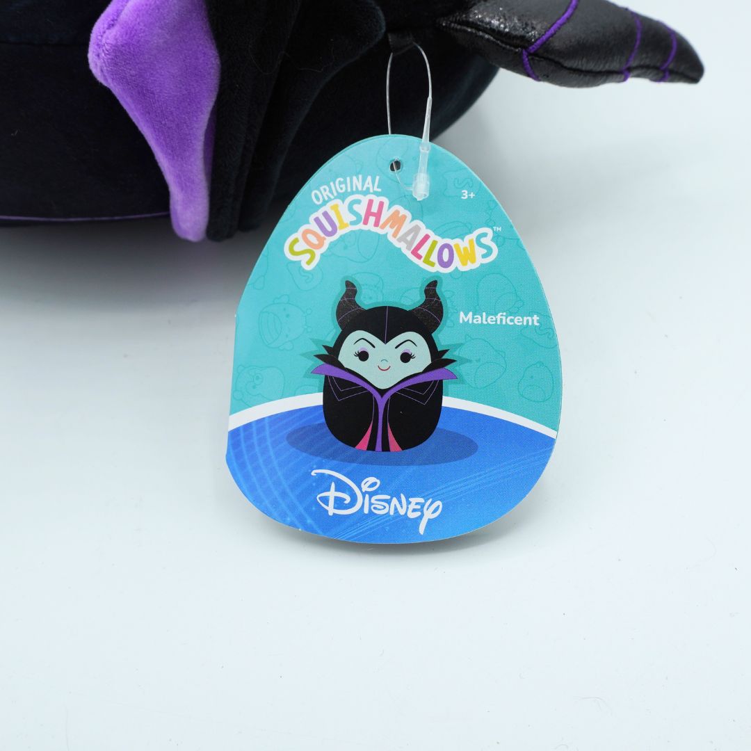 A Disney 'Original Squishmallows' Maleficent plush toy with its original retail hangtag, shown on a clean white background.