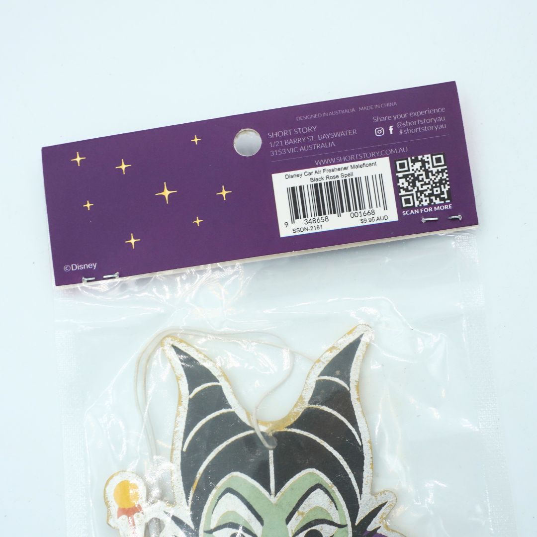 Disney Maleficent character ornament in its clear plastic packaging, shown with its purple cardboard header card featuring gold stars and a barcode.