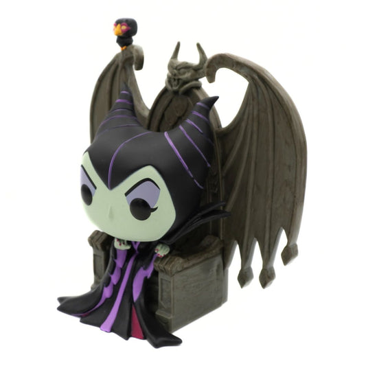 Toy figure of a character with dark hair and cape on a white background