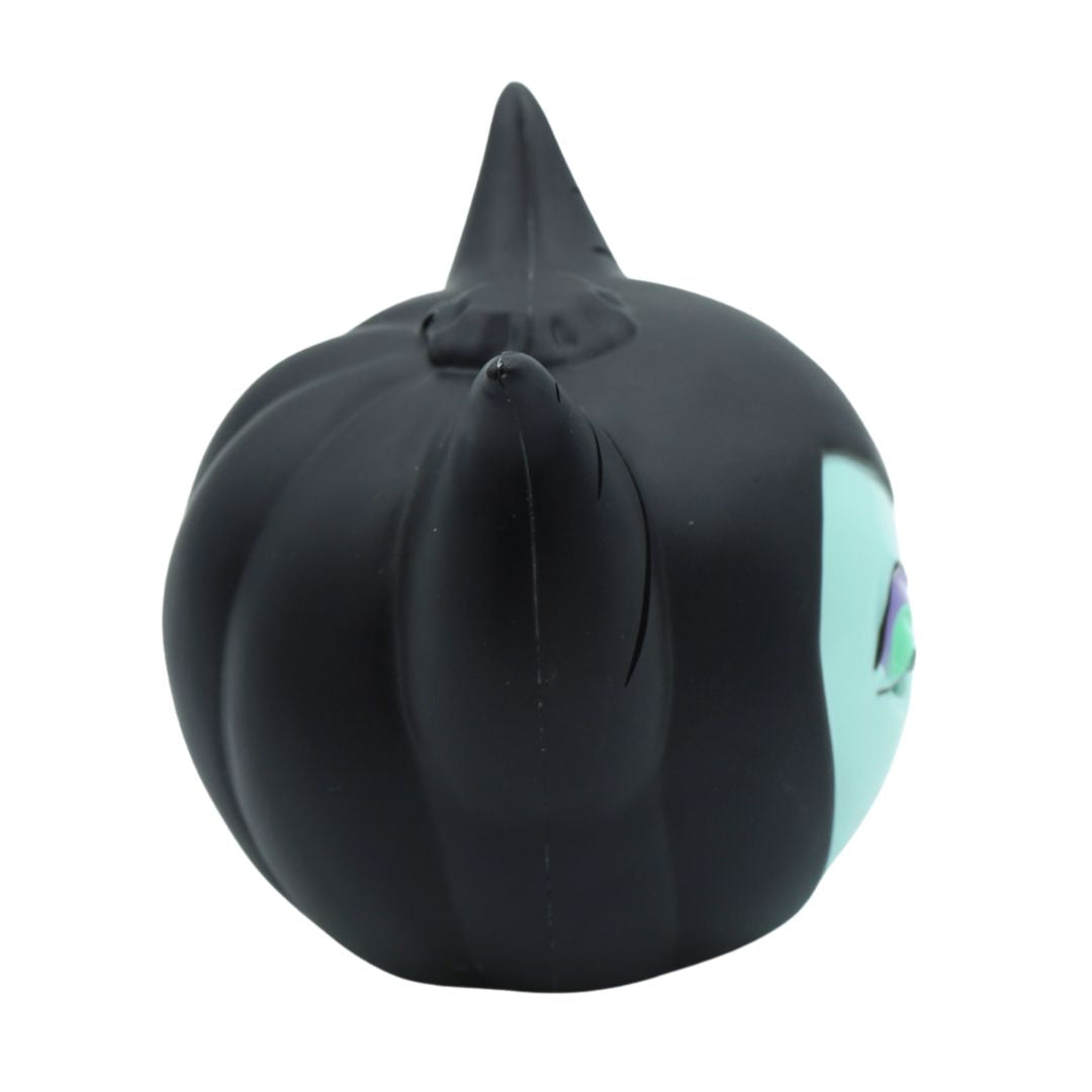 A black pumpkin-shaped squishy toy featuring a pointed top and a side cutout revealing a mint green interior, set against a plain white background.