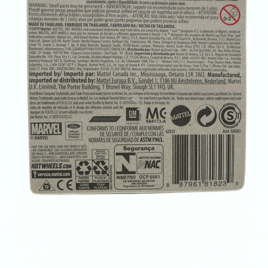 Back of a toy packaging with branding and product information on a white background