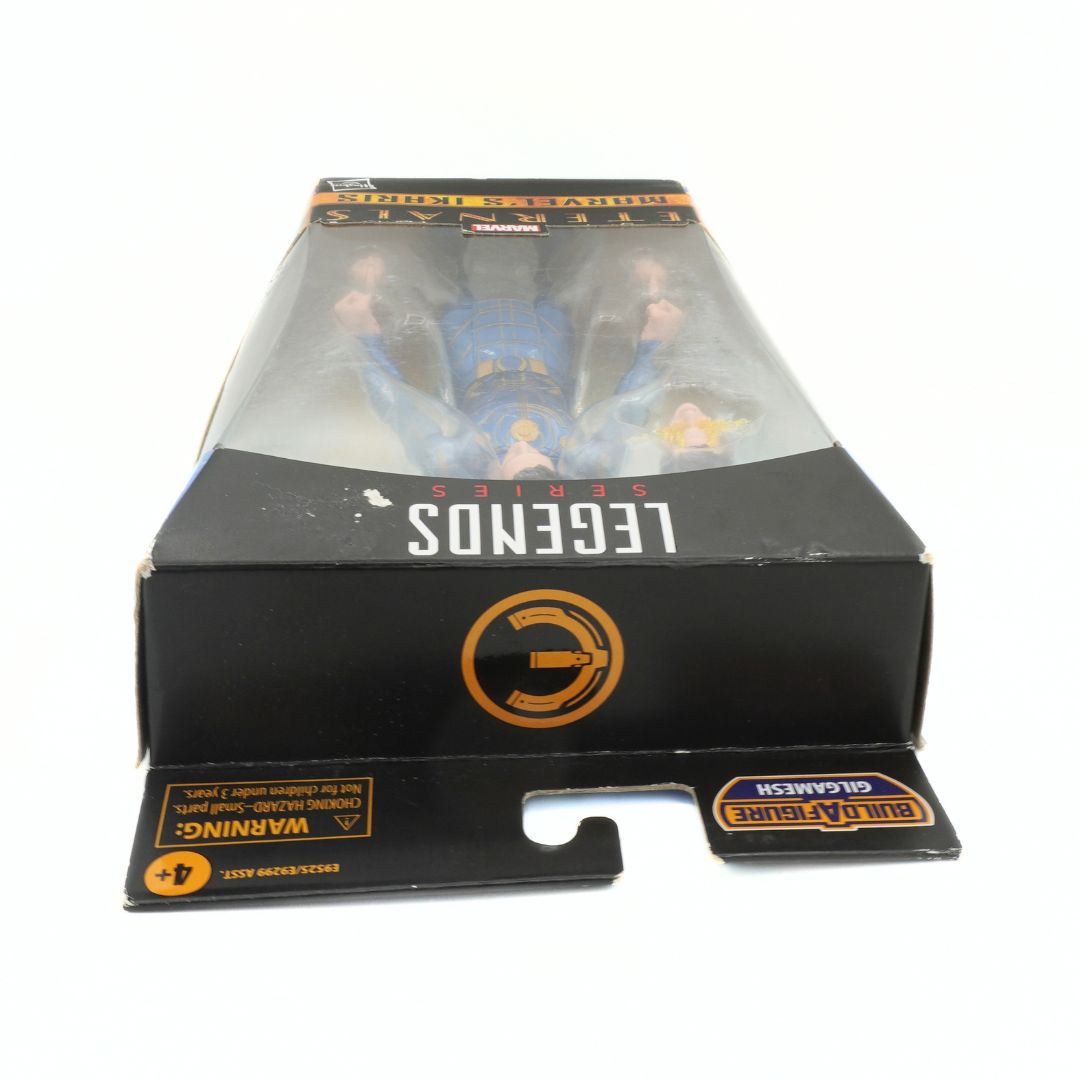 Toy figure in packaging with 'Legends' branding on a white background