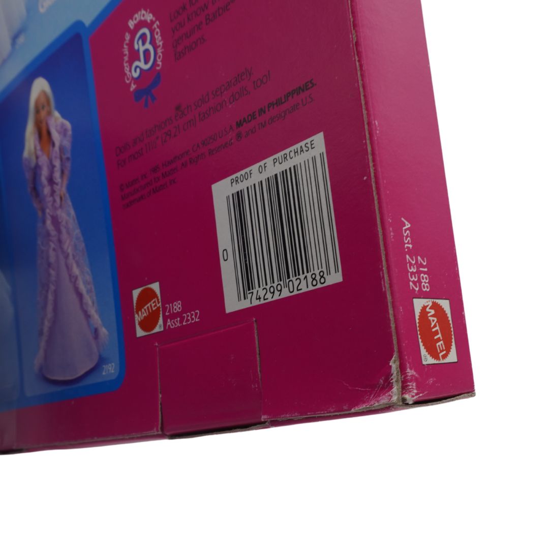 Back of a Barbie doll packaging with barcode and Mattel logo
