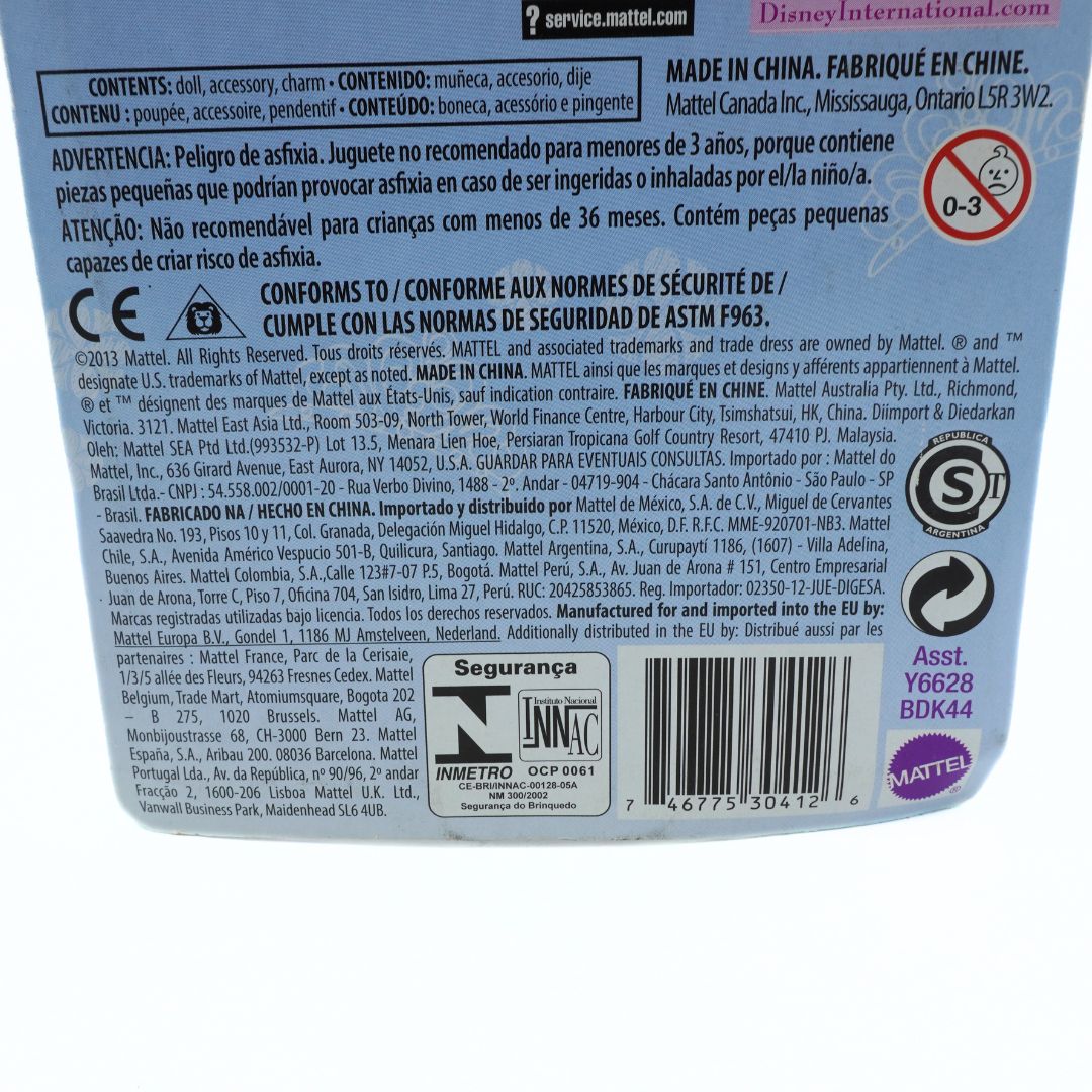 Back of a toy packaging with text, barcodes, and logos on a white background