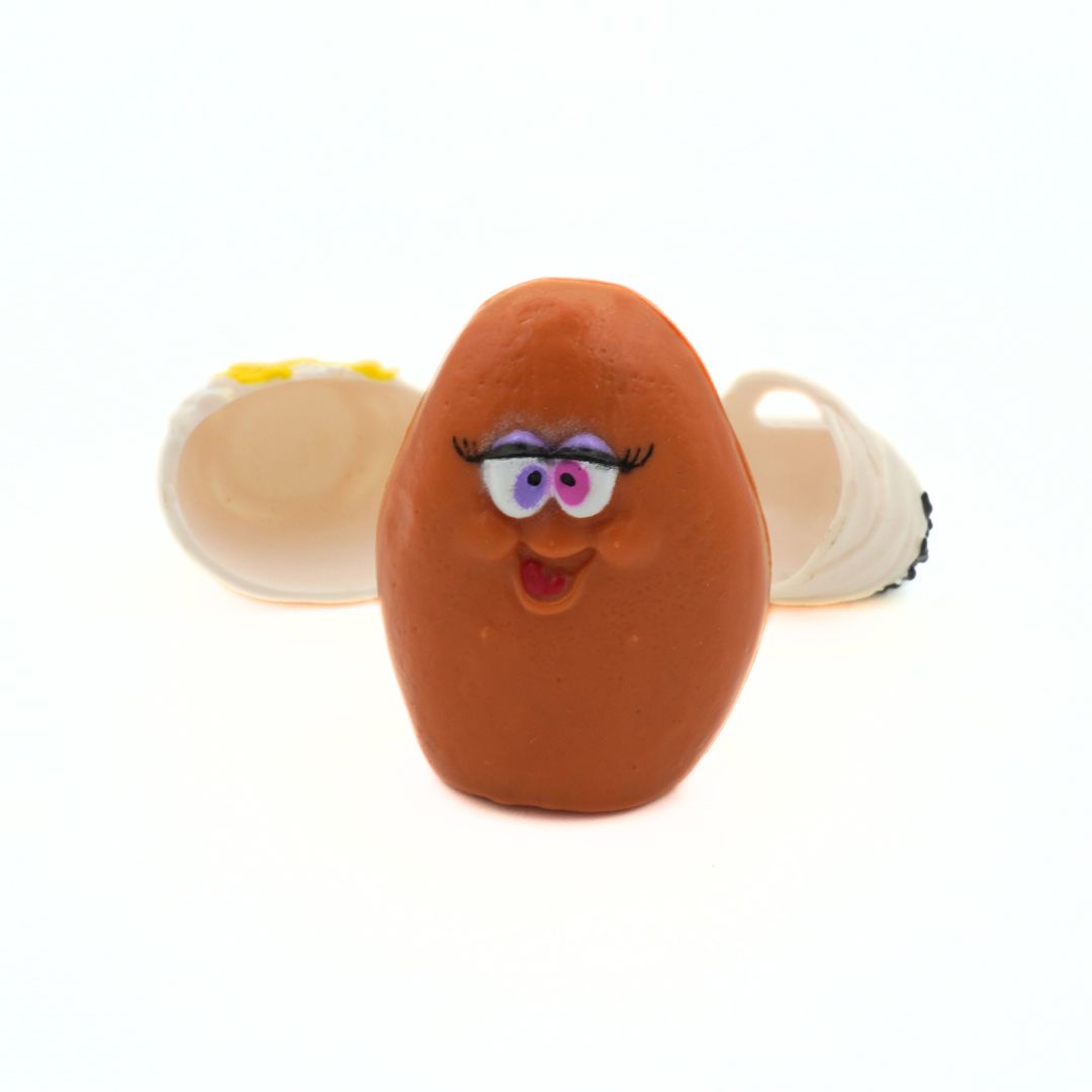 A 1992 Halloween McNugget toy outside of its white mummy costume