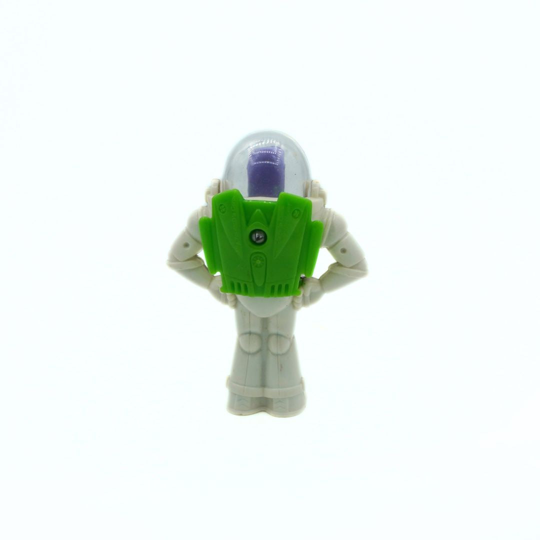 Toy figure resembling a space explorer with a green suit on a white background