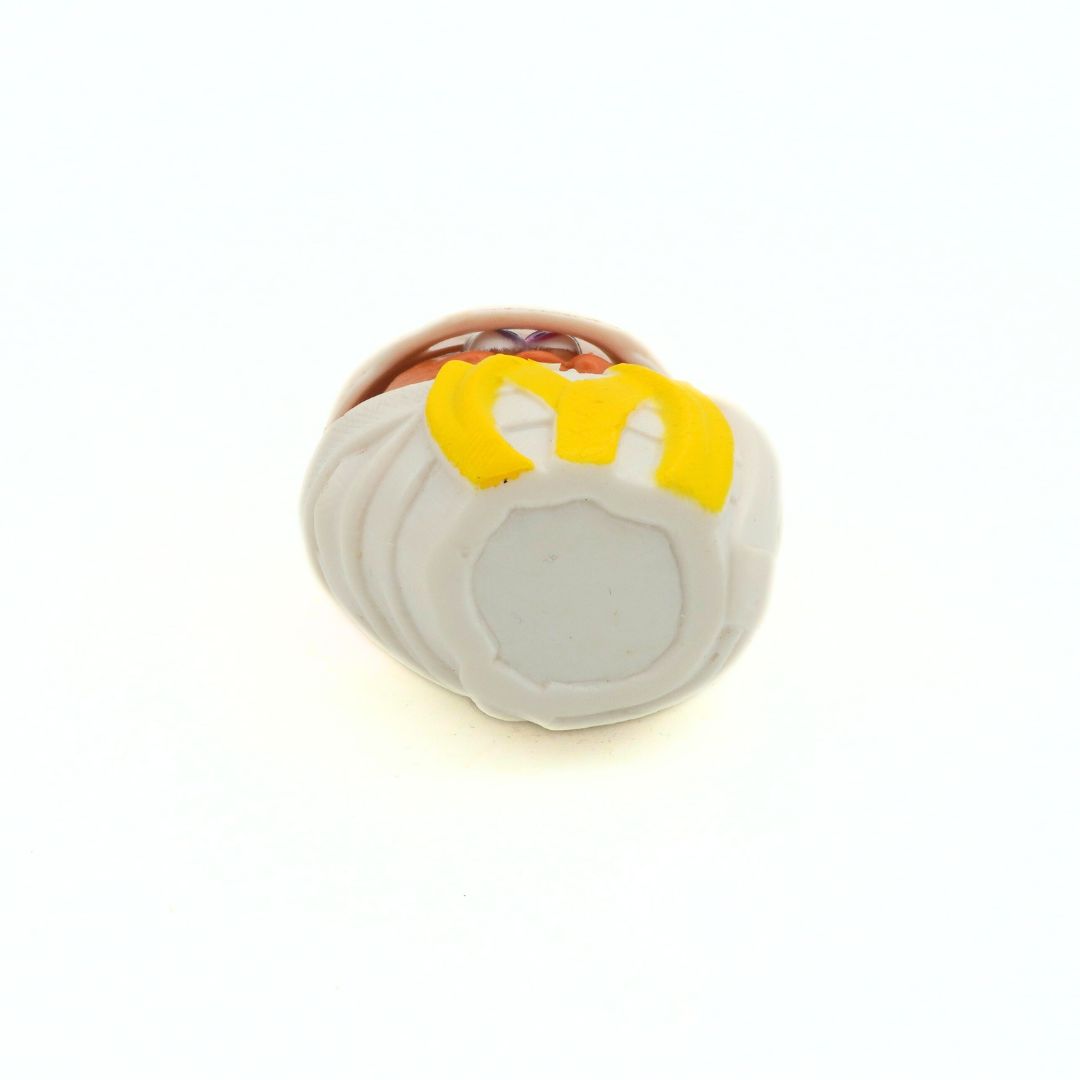 Underside of a vintage 1992 McDonalds McNugget Halloween Buddy toy in a mummy costume