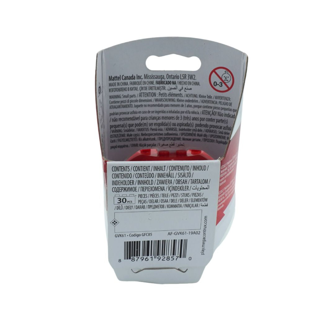 The back of a a Mega Construx toy showing product information, barcode, and warning labels on a white background.