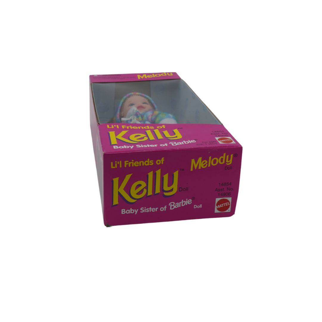 Underside of a vintage 1995 Lil Friends of Kelly Melody doll in a pink box