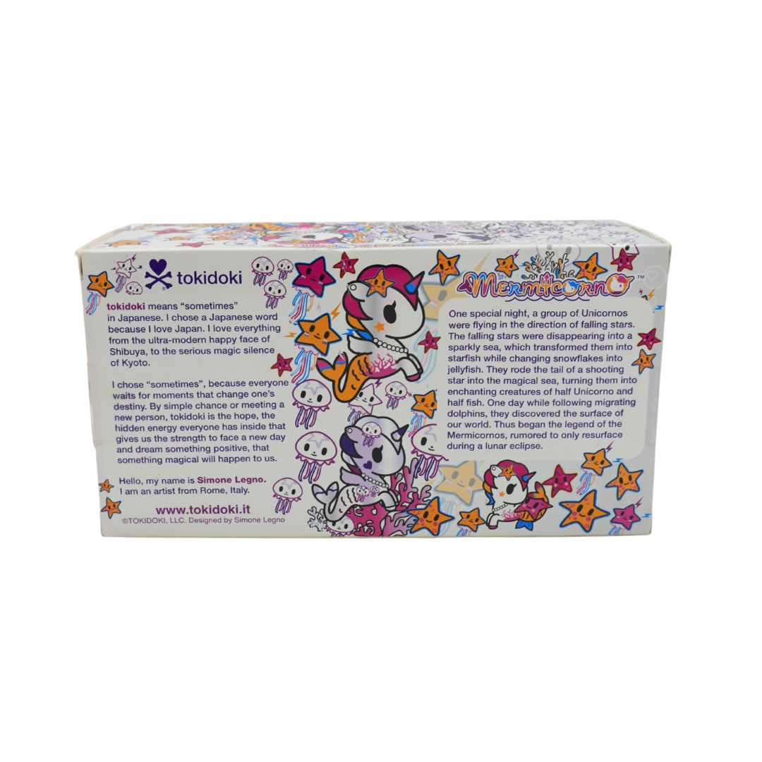 Photo of a colourful Mermicorno Tokidoki box with a set of two purple and white vinyl figurines