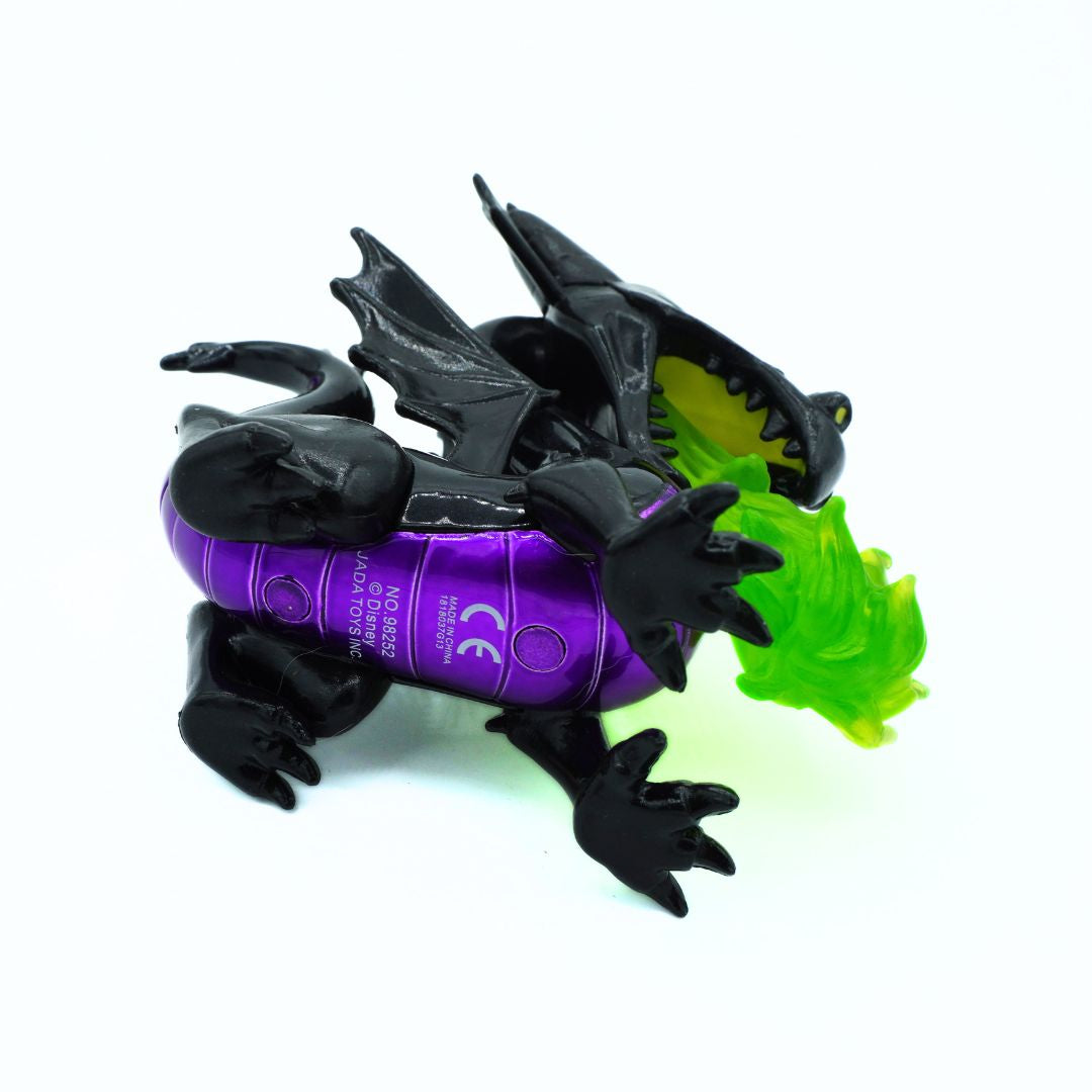 A small black dragon toy with a purple belly and a bright green mouth flame, shown on a plain white background.
