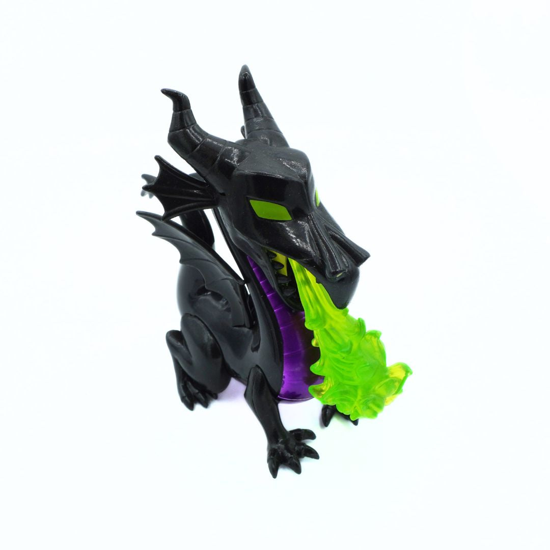 A black dragon figurine with glowing green eyes and mouth, breathing a translucent green flame, set against a plain white background.