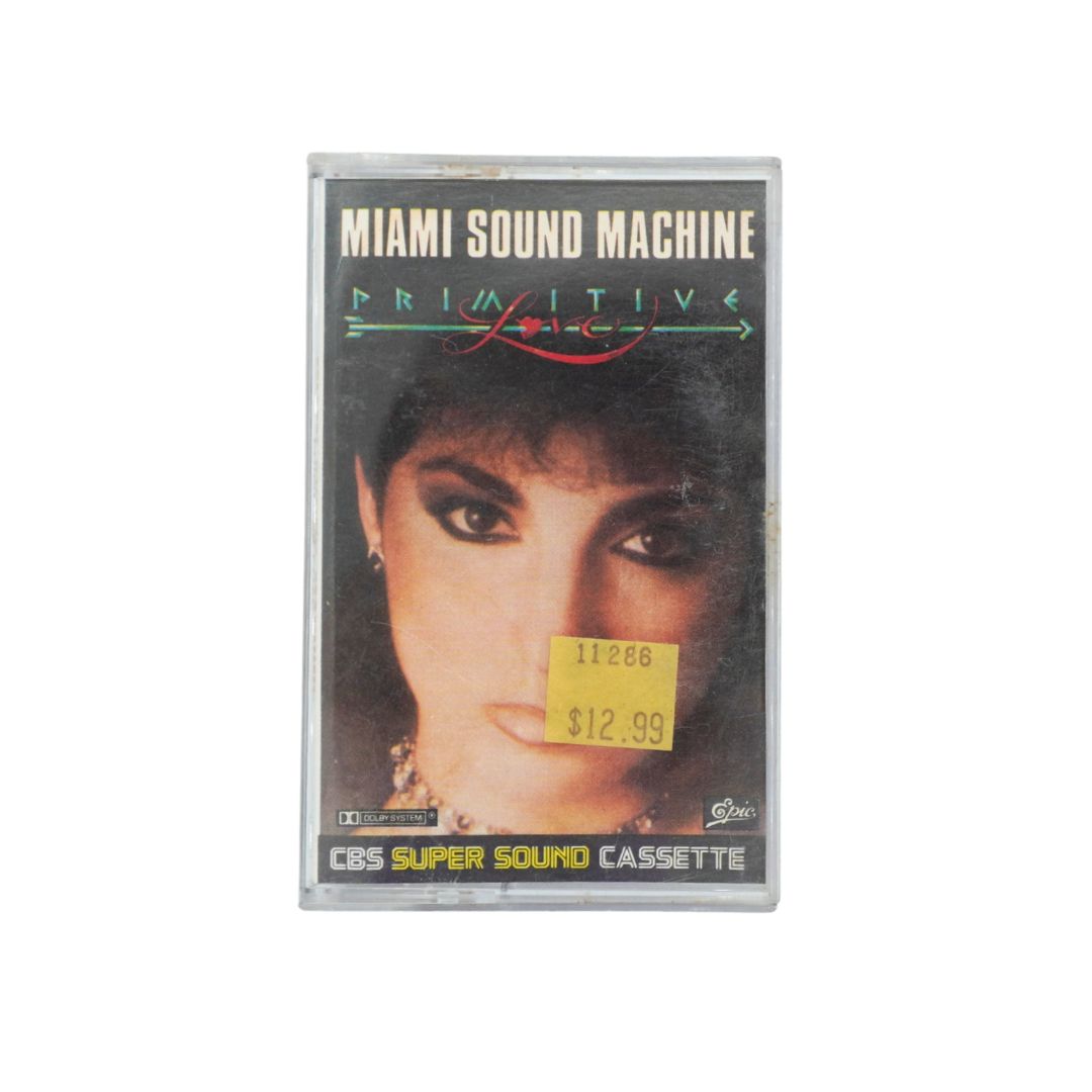 Front cover of a Miami Sound Machine cassette for Primitive Love featuring Gloria Estefan and an original yellow price sticker