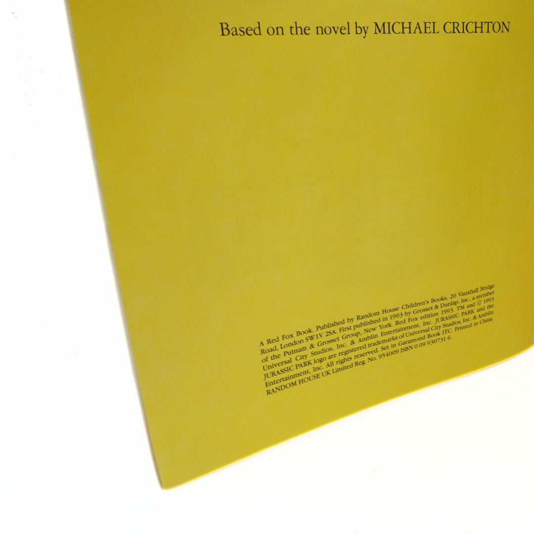Yellow book cover with text crediting Michael Crichton