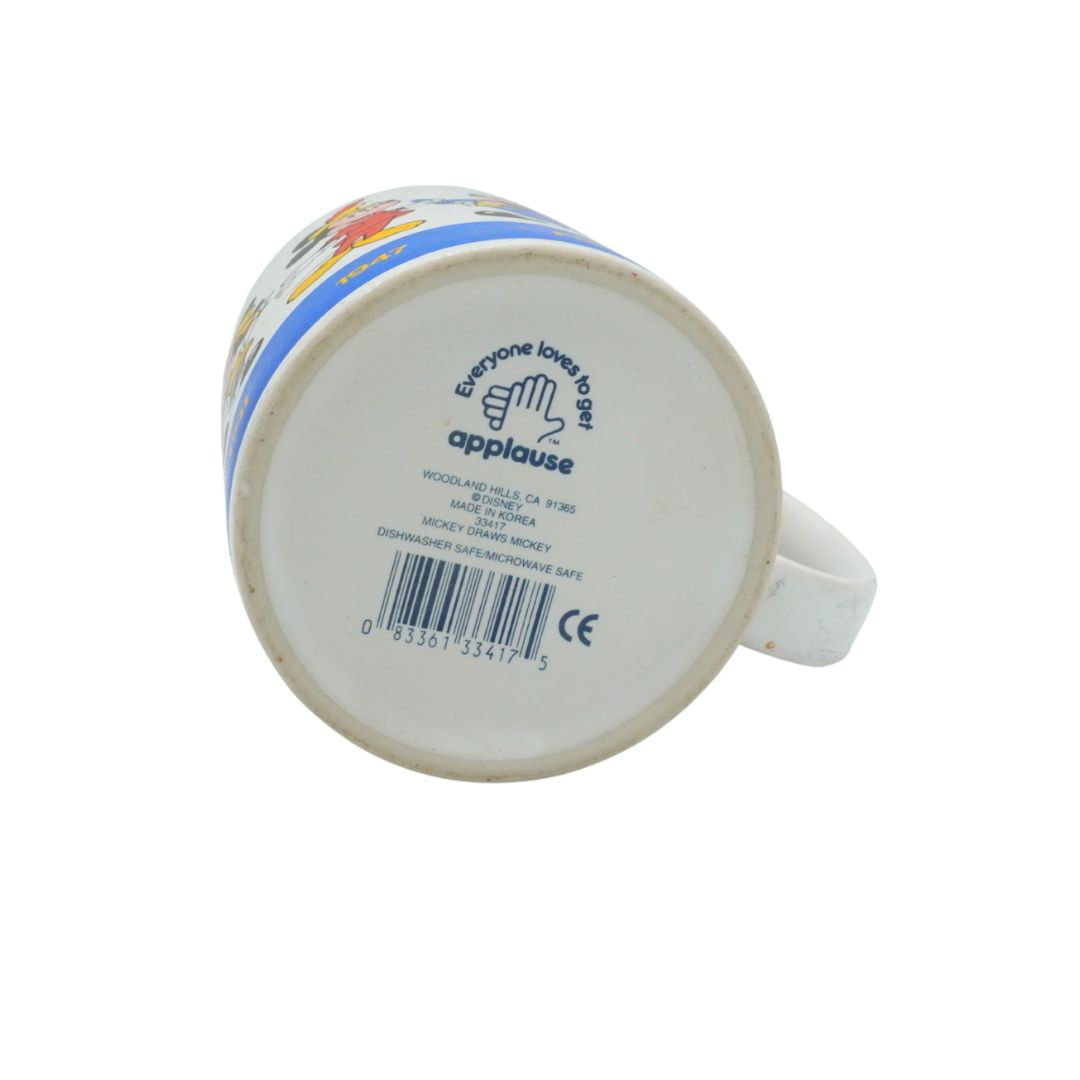 Back view of a mug with branding and product details on a white background