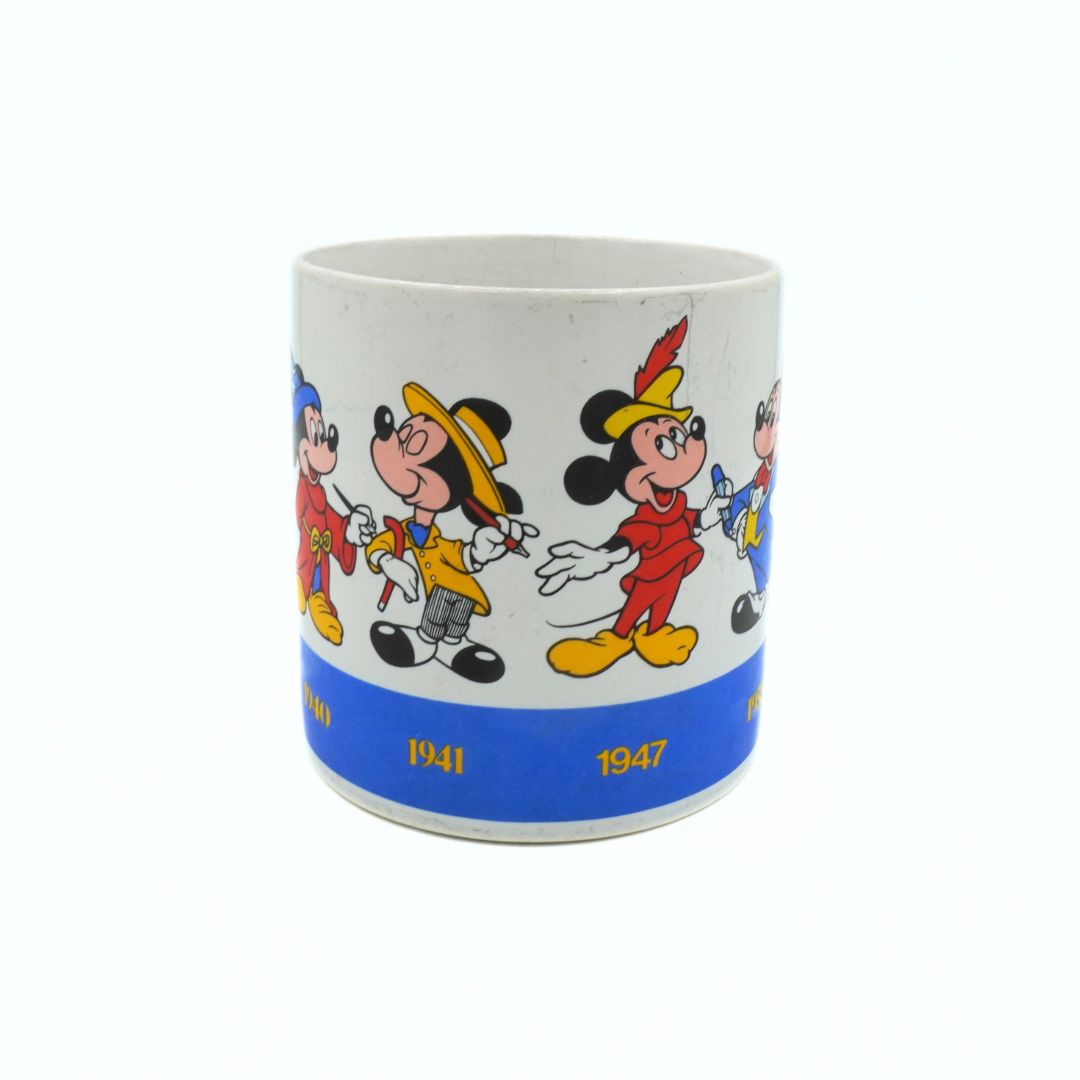 Mug with cartoon characters and years 1941 and 1947 on a white background