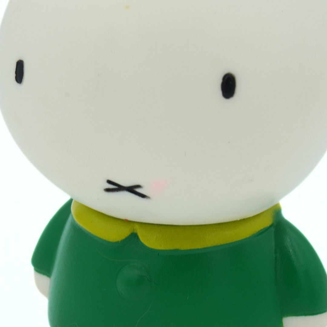 Closeup of a vintage Asahi Bank branded Miffy Piggy bank showing a pink mark to the face
