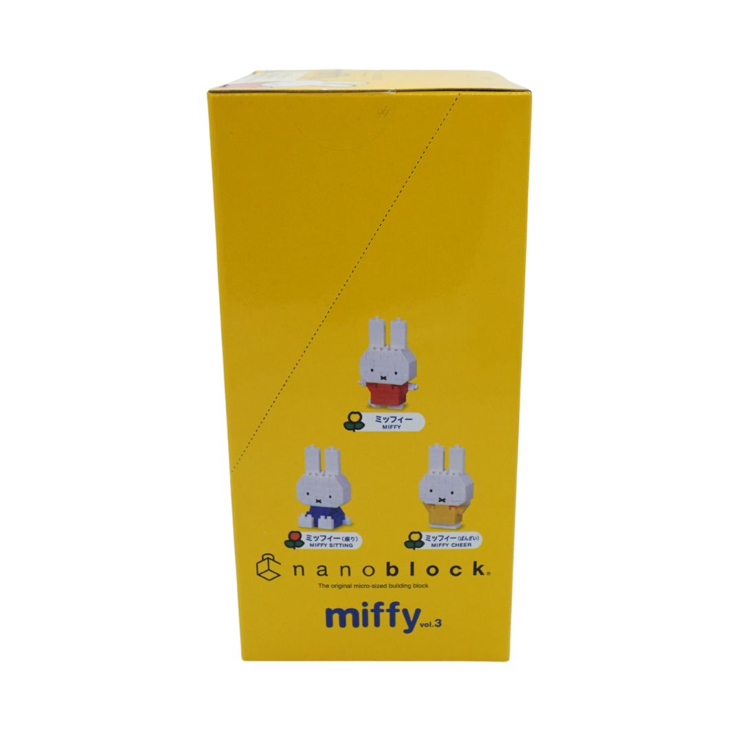 A yellow Nanoblock collectible figure box featuring illustrations of Miffy in three outfits with Japanese text, on a plain white background.