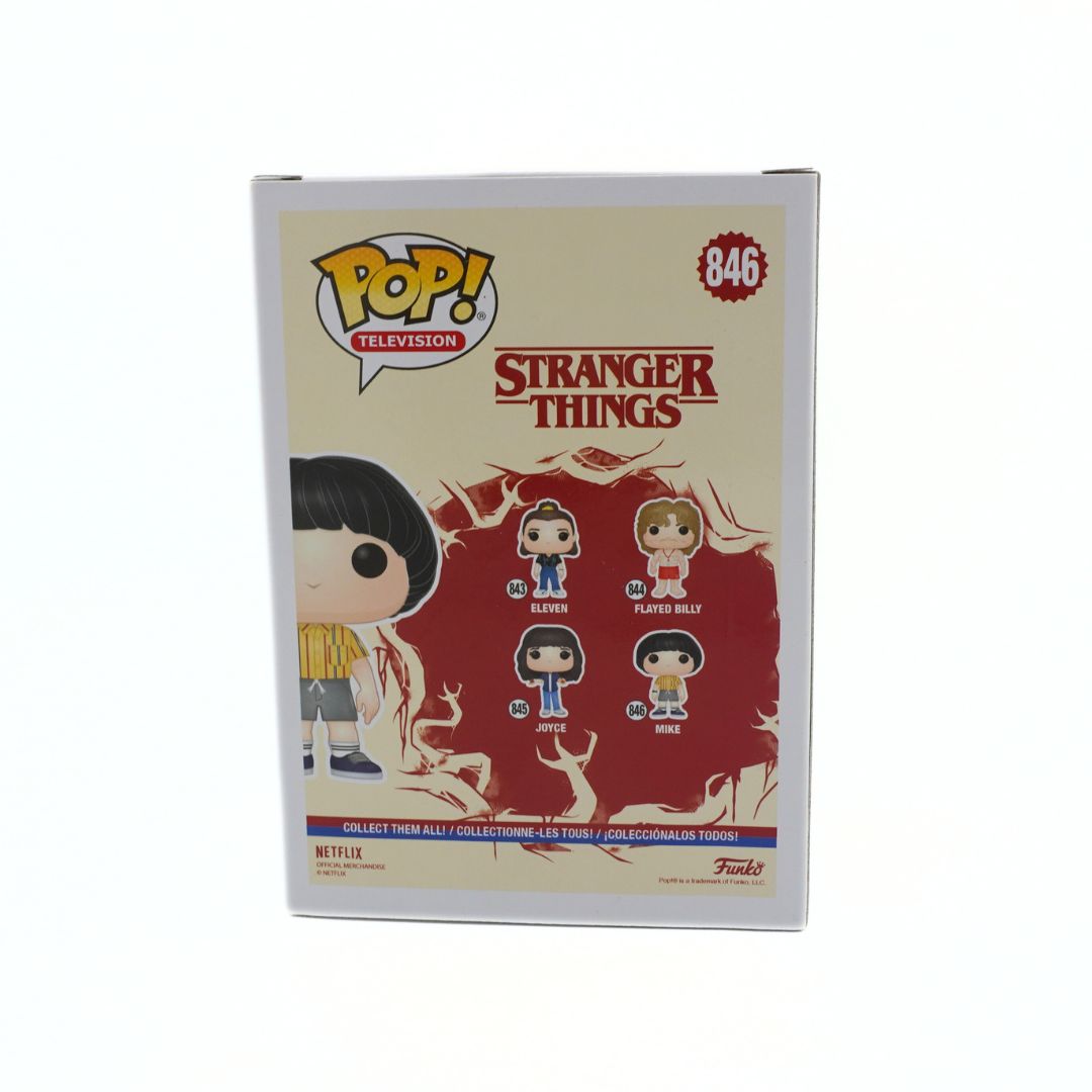 Funko Pop! Stranger Things packaging with character illustrations on a beige background