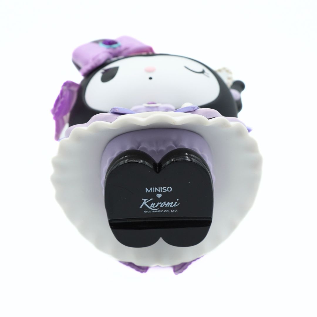 A Miniso Kuromi plush toy wearing a large white scalloped hat with a black heart-shaped center, photographed on a plain white background.