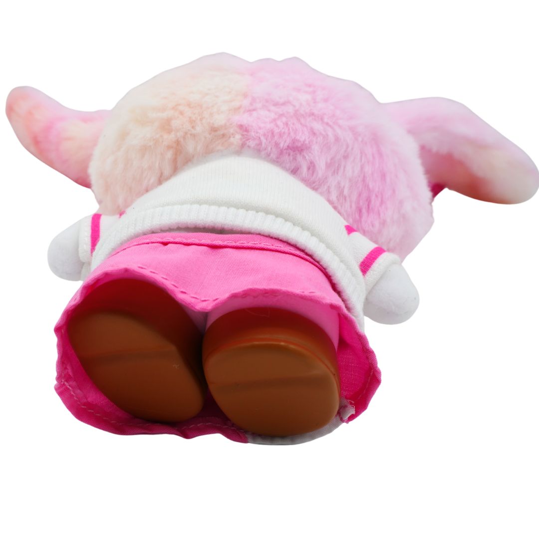 Underside of a Hello Kitty plush bag charm showing her pink outfit and brown shoes
