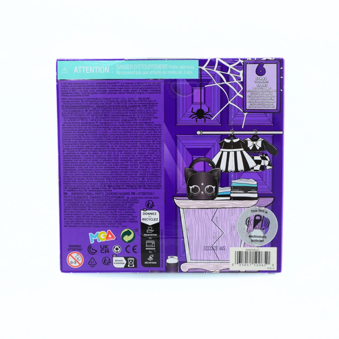 The back of a purple retail box for a Halloween-themed doll accessory set, featuring a purple door illustration, spiderweb, black cat doll, striped dress, and small table with books.