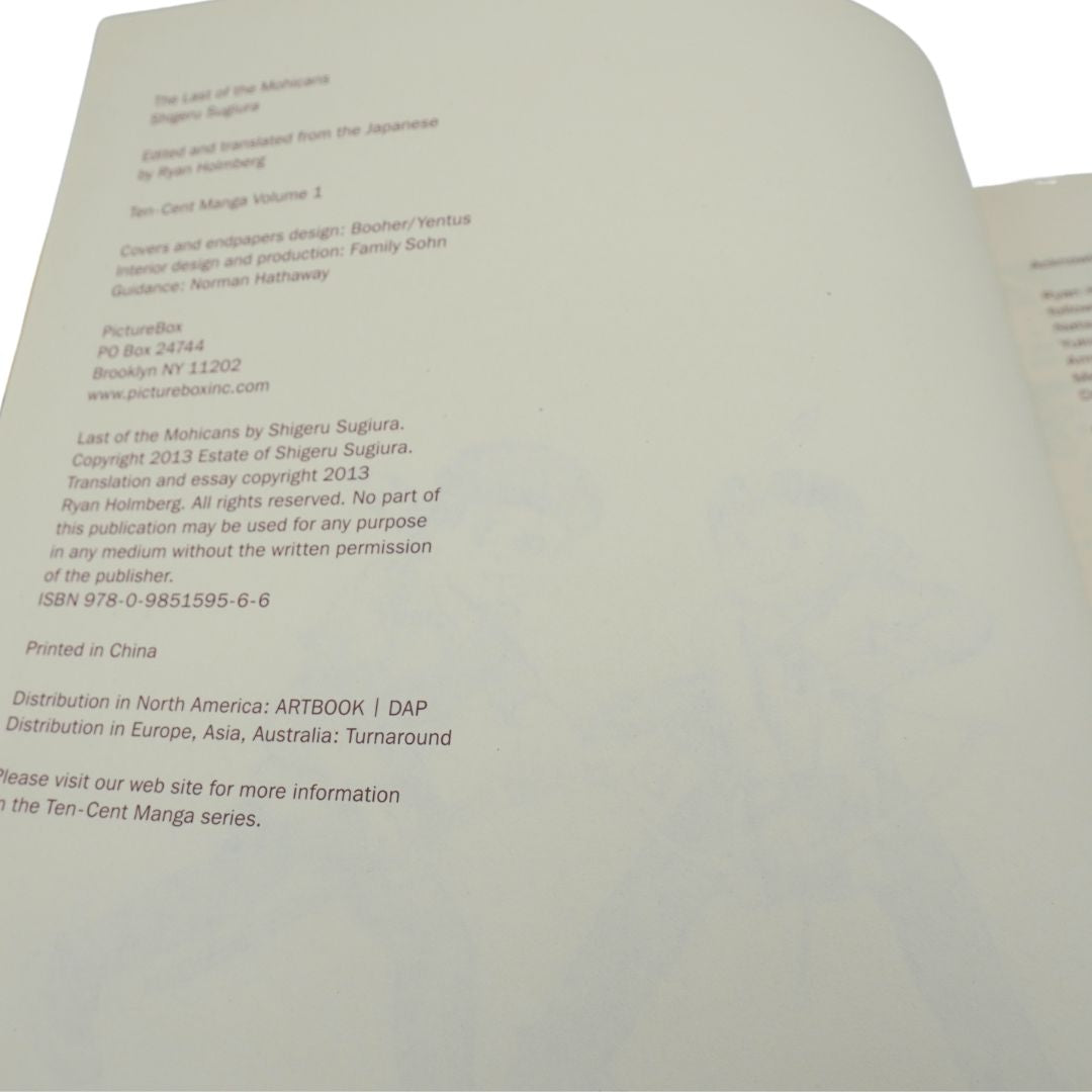 A close-up of an open book's inner page showing printed publication details and copyright text in black on off-white paper.