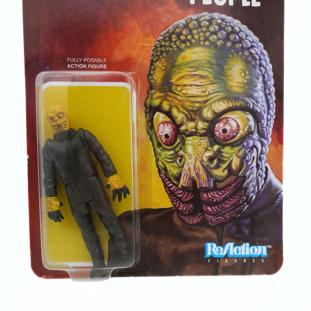 Close of a Mole Person figurine in its original packaging