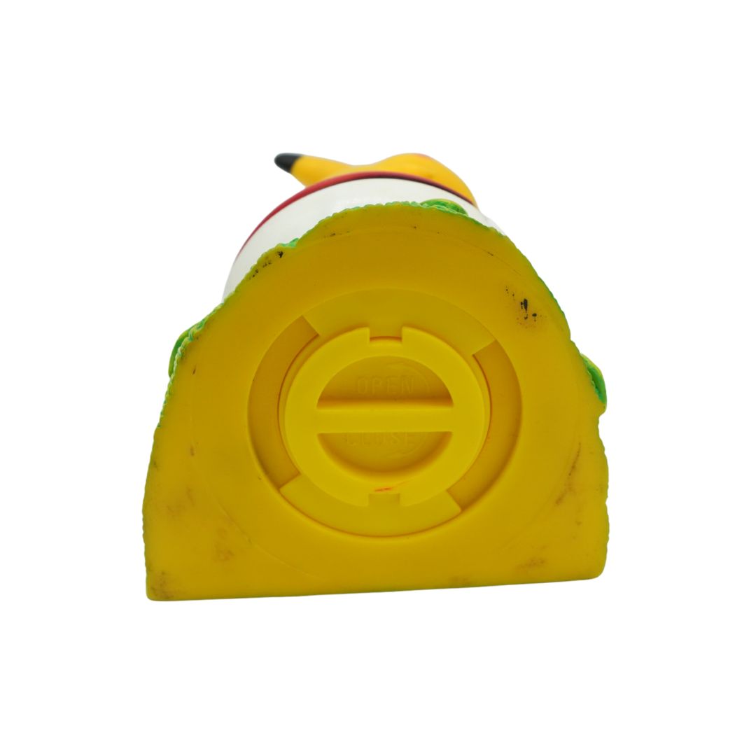 Moneybox with a character on top against a white background