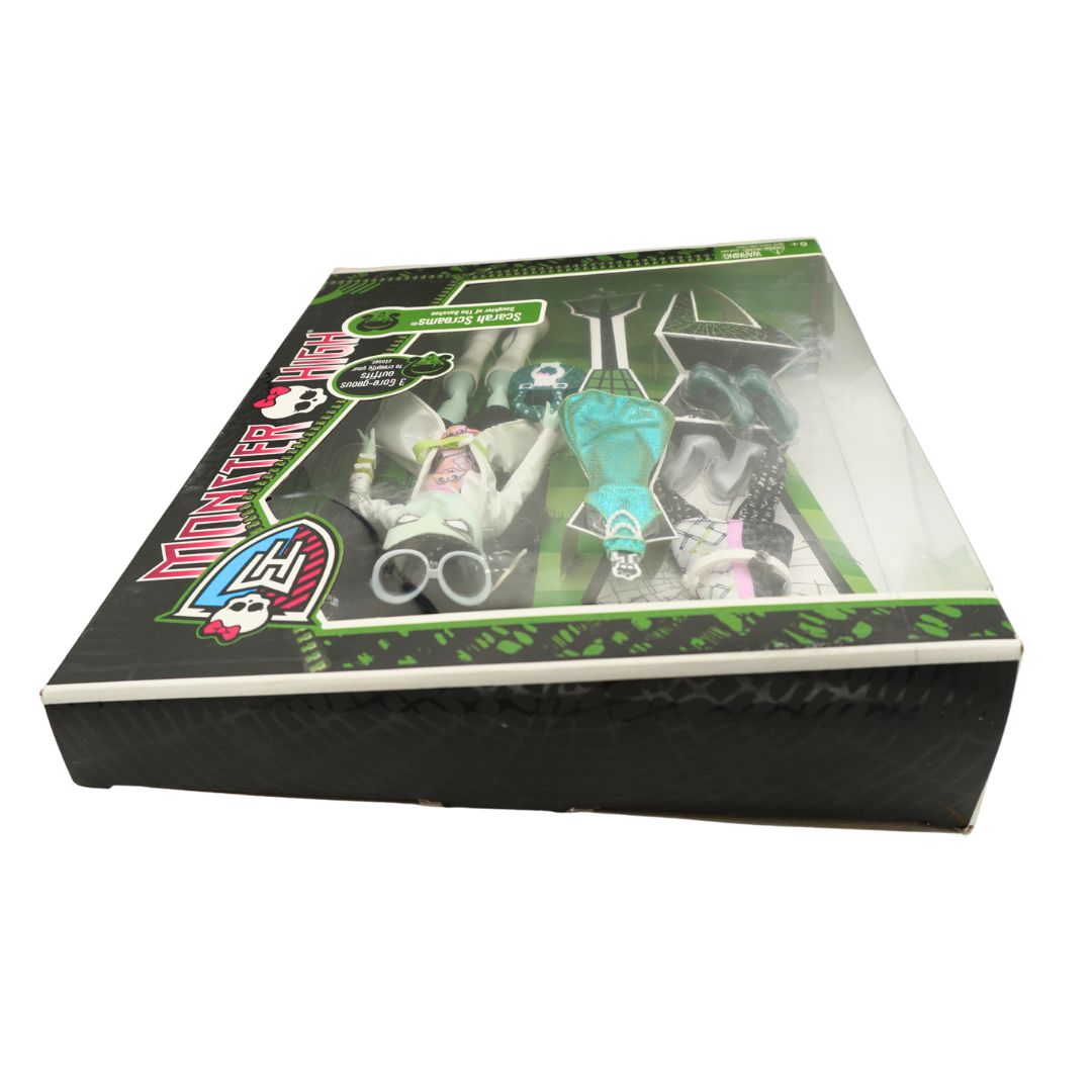 Monster High themed toy set in its original retail packaging, featuring a black box with a clear window showing three dolls dressed in themed outfits.