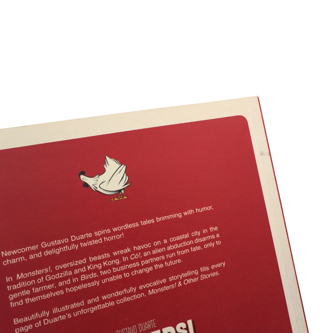 A close-up of a book or booklet cover with a red background, white text, and a small cartoon chicken illustration near the top.