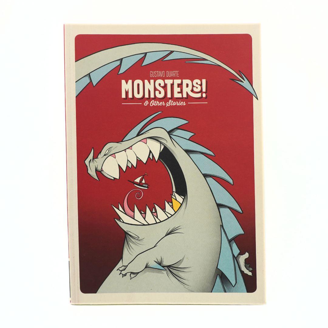 A book titled 'Monsters! & Other Stories' featuring a stylized illustration of a roaring monster on a red cover, photographed against a plain white background.