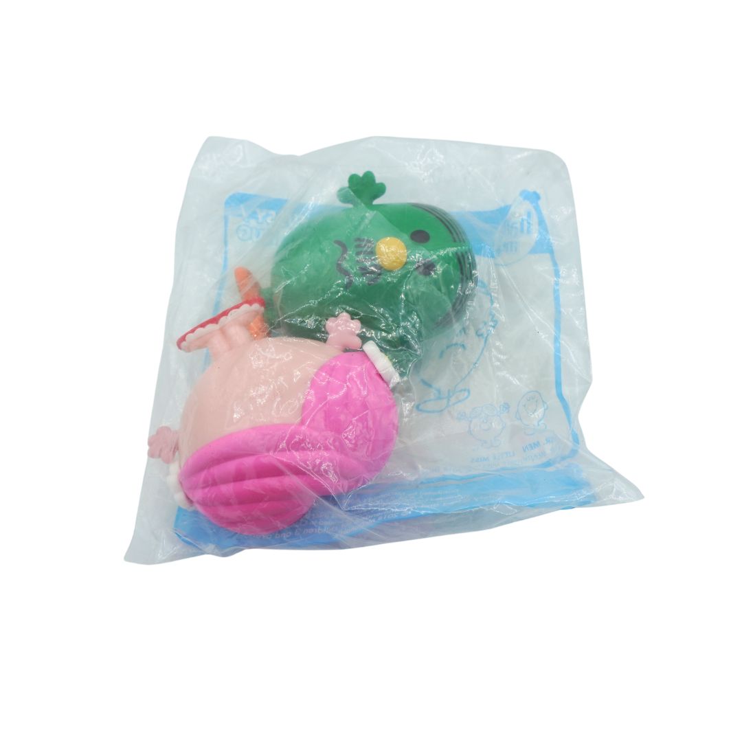 A small plush toy inside a clear plastic bag with a blue printed backing, photographed on a plain white background.