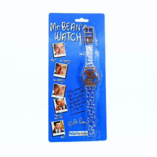 A Mr. Bean themed watch in its original blue blister packaging, featuring a clear strap with white patterns and a blue watch face.